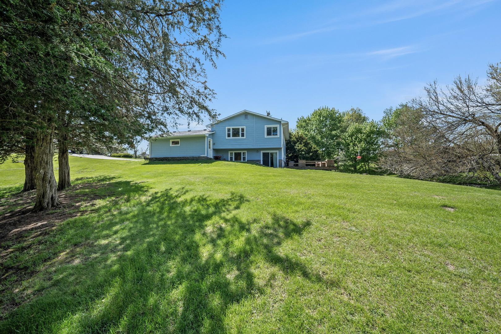24146 Stage Coach Road Geneseo, IL 61254 - Photo 33 of 39 a front view of a house with a yard