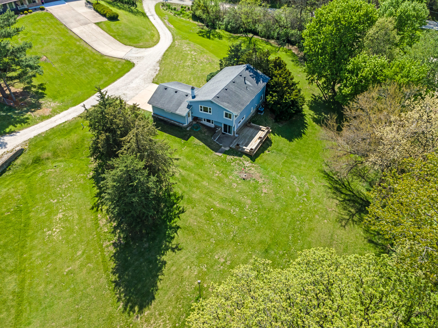 24146 Stage Coach Road Geneseo, IL 61254 - Photo 37 of 39 an aerial view of a house with a garden and trees