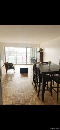 a view of a dining room with furniture and a table