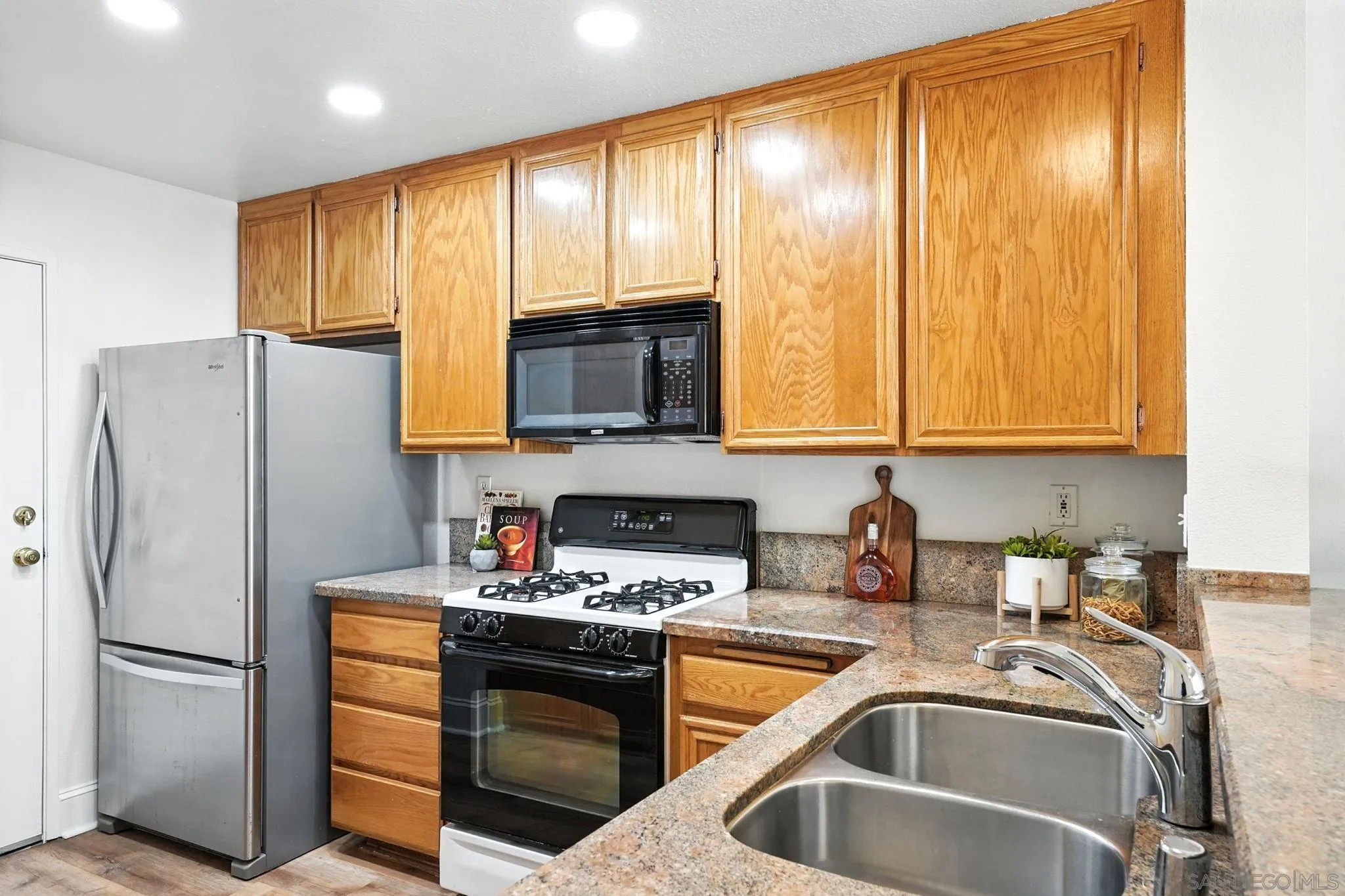 29581 Cara Way Temecula, CA 92591 - Photo 11 of 24 a kitchen with stainless steel appliances granite countertop a refrigerator stove and sink