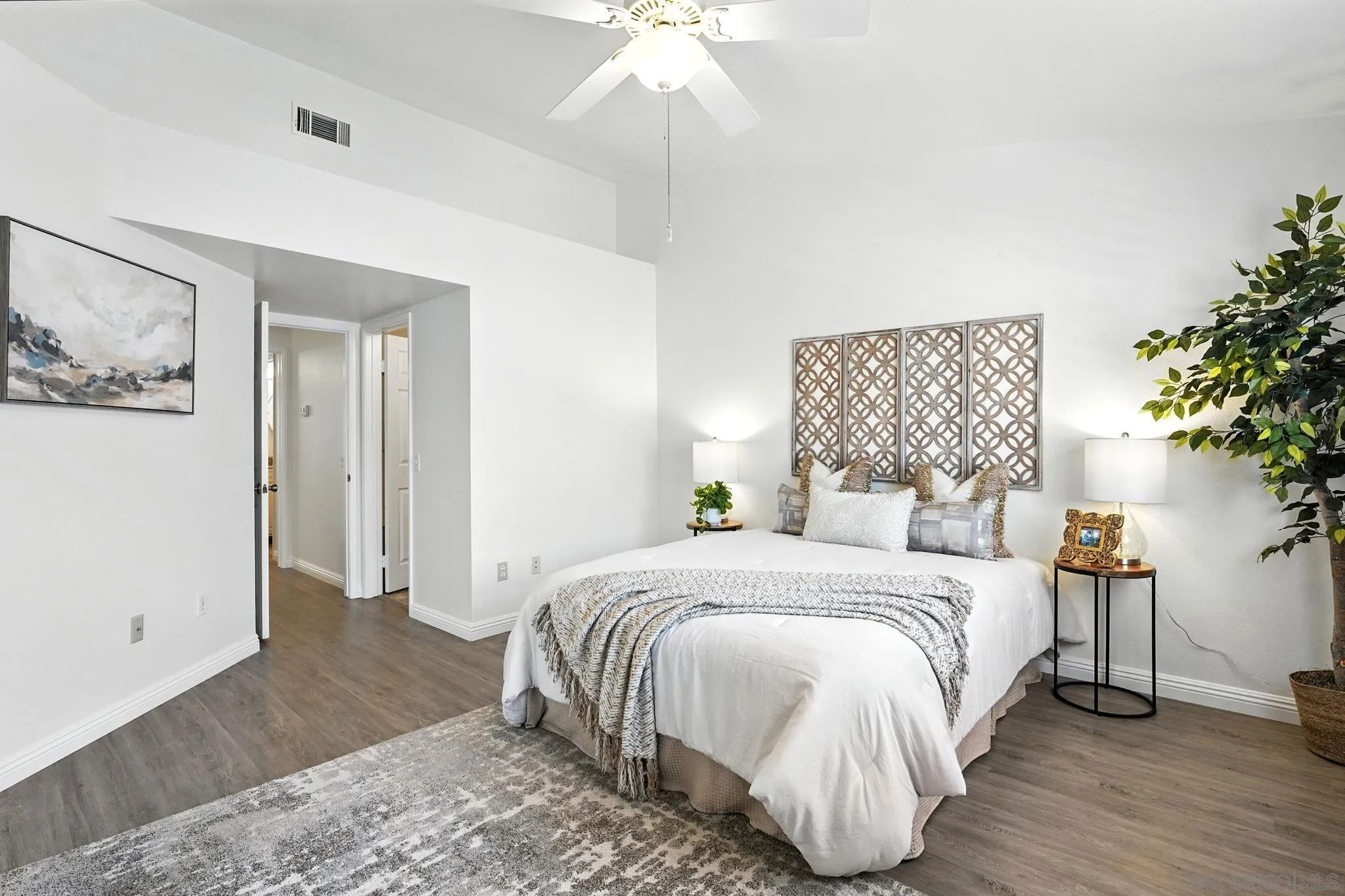 29581 Cara Way Temecula, CA 92591 - Photo 14 of 24 a bedroom with a bed and a chandelier