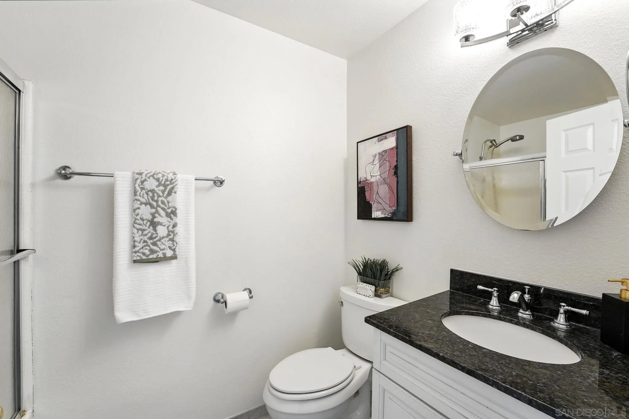 29581 Cara Way Temecula, CA 92591 - Photo 17 of 24 a bathroom with a granite countertop sink mirror and toilet