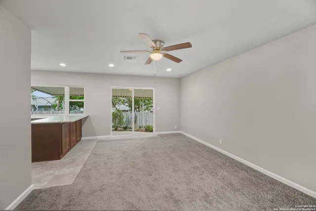 a view of a kitchen with a sink and a window