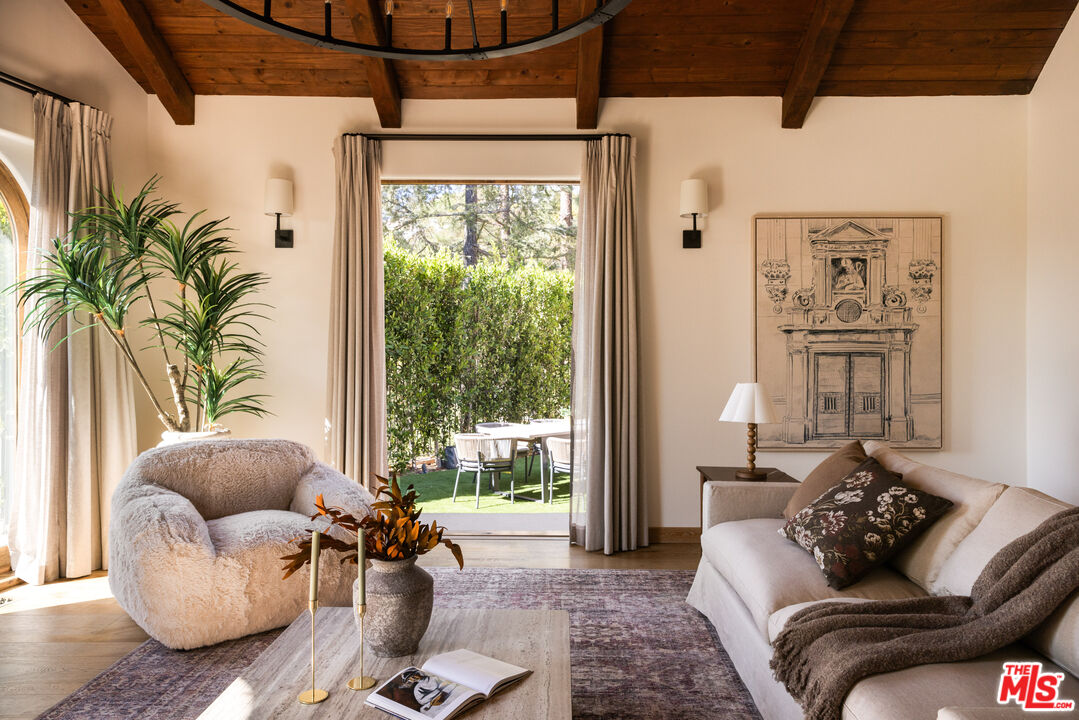 7935 Oceanus Drive Los Angeles, CA 90046 - Photo 11 of 43 a living room with furniture and a large window