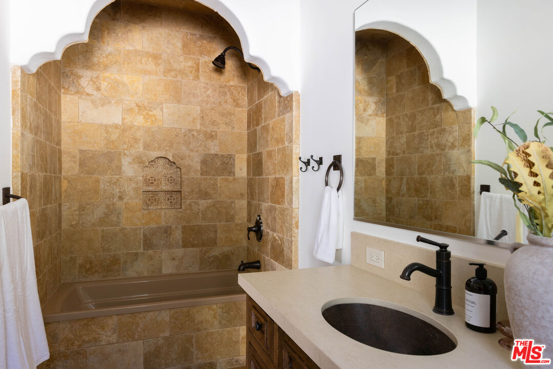 7935 Oceanus Drive Los Angeles, CA 90046 - Photo 32 of 43 a bathroom with a sink a toilet and shower