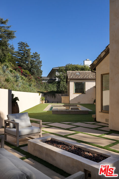 7935 Oceanus Drive Los Angeles, CA 90046 - Photo 42 of 43 a view of a house with a yard