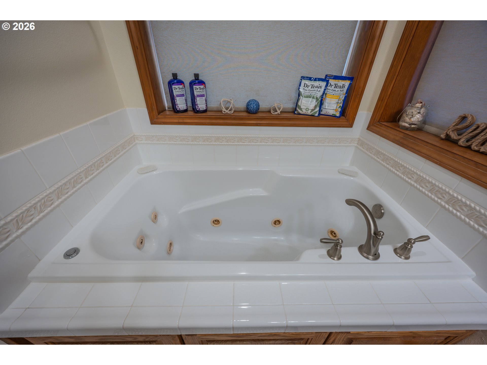 2193 13th Street Florence, OR 97439 - Photo 37 of 48 a bath tub sitting next to a white sink and vanity