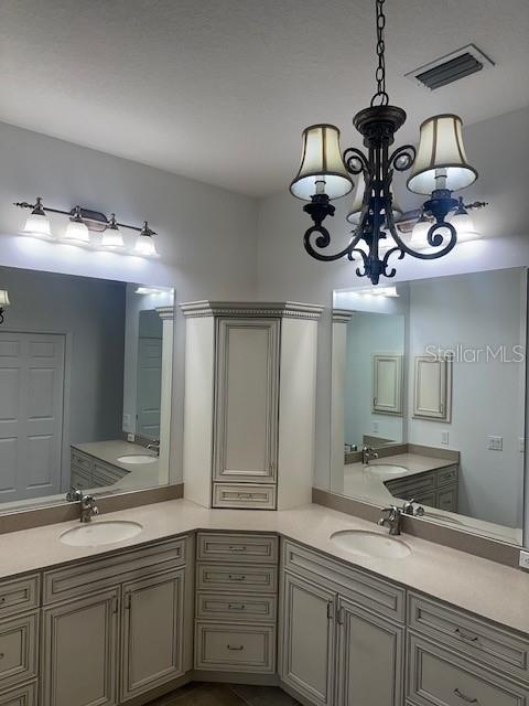 10228 Silverado Circle Lakewood Ranch, FL 34202 - Photo 12 of 20 a bathroom with a sink and a mirror