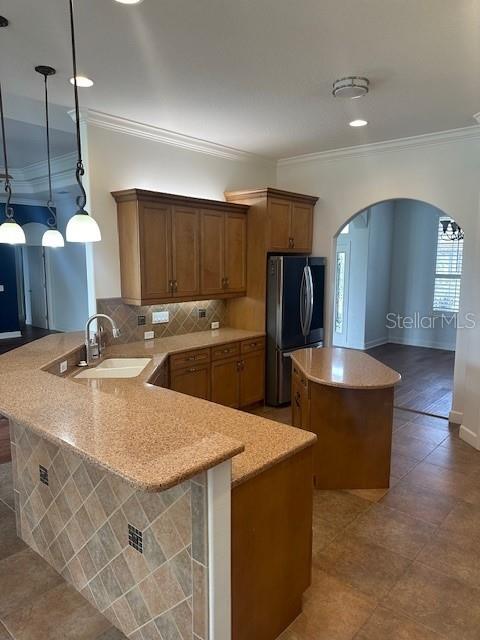 10228 Silverado Circle Lakewood Ranch, FL 34202 - Photo 6 of 20 a kitchen with stainless steel appliances kitchen island granite countertop a sink a stove and a refrigerator