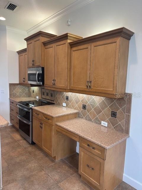 10228 Silverado Circle Lakewood Ranch, FL 34202 - Photo 7 of 20 a kitchen with stainless steel appliances granite countertop a stove a sink and a microwave