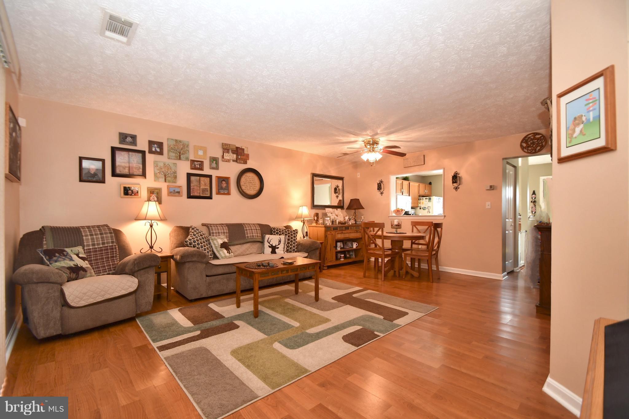 3924 Cutty Sark Road Baltimore, MD 21220 - Photo 11 of 30 a living room with furniture and wooden floor