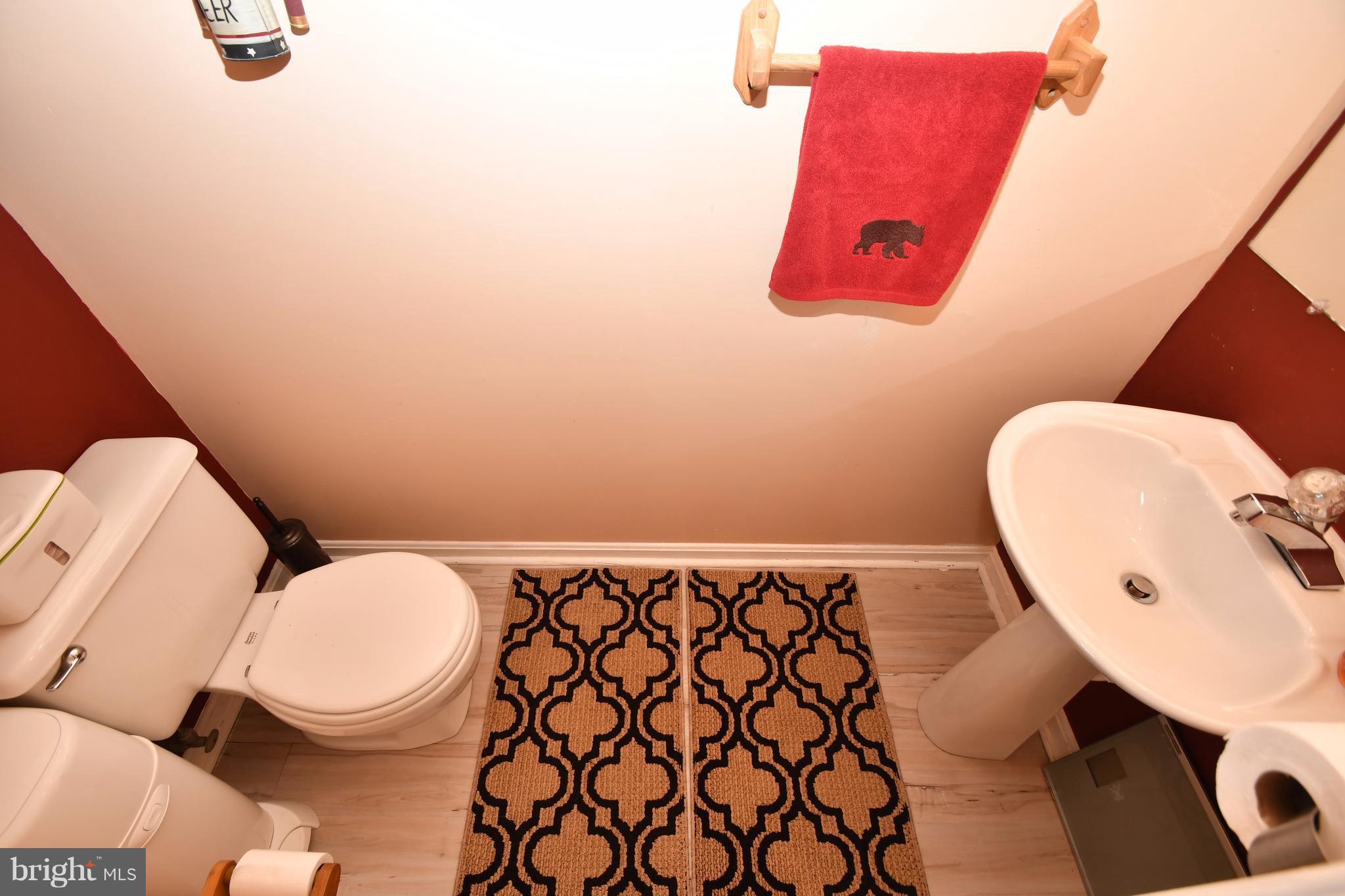 3924 Cutty Sark Road Baltimore, MD 21220 - Photo 13 of 30 a bathroom with a toilet and a mirror