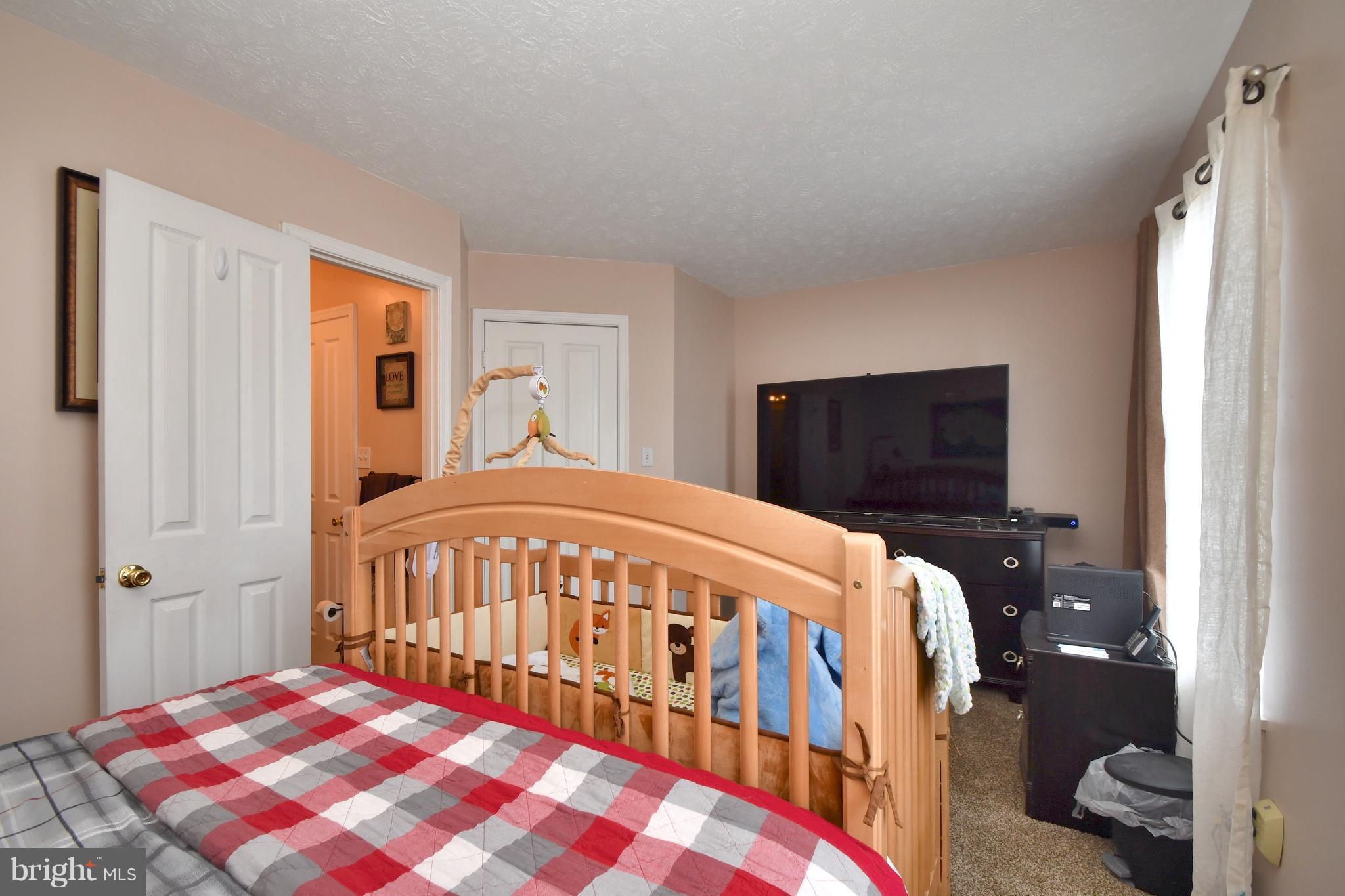 3924 Cutty Sark Road Baltimore, MD 21220 - Photo 14 of 30 a bedroom with a bed and a window