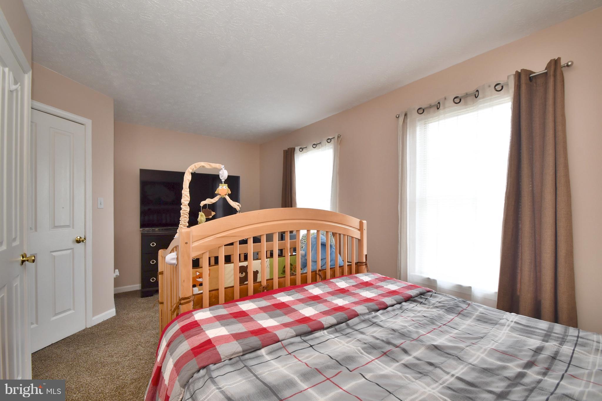 3924 Cutty Sark Road Baltimore, MD 21220 - Photo 15 of 30 a bedroom with a bed and a window