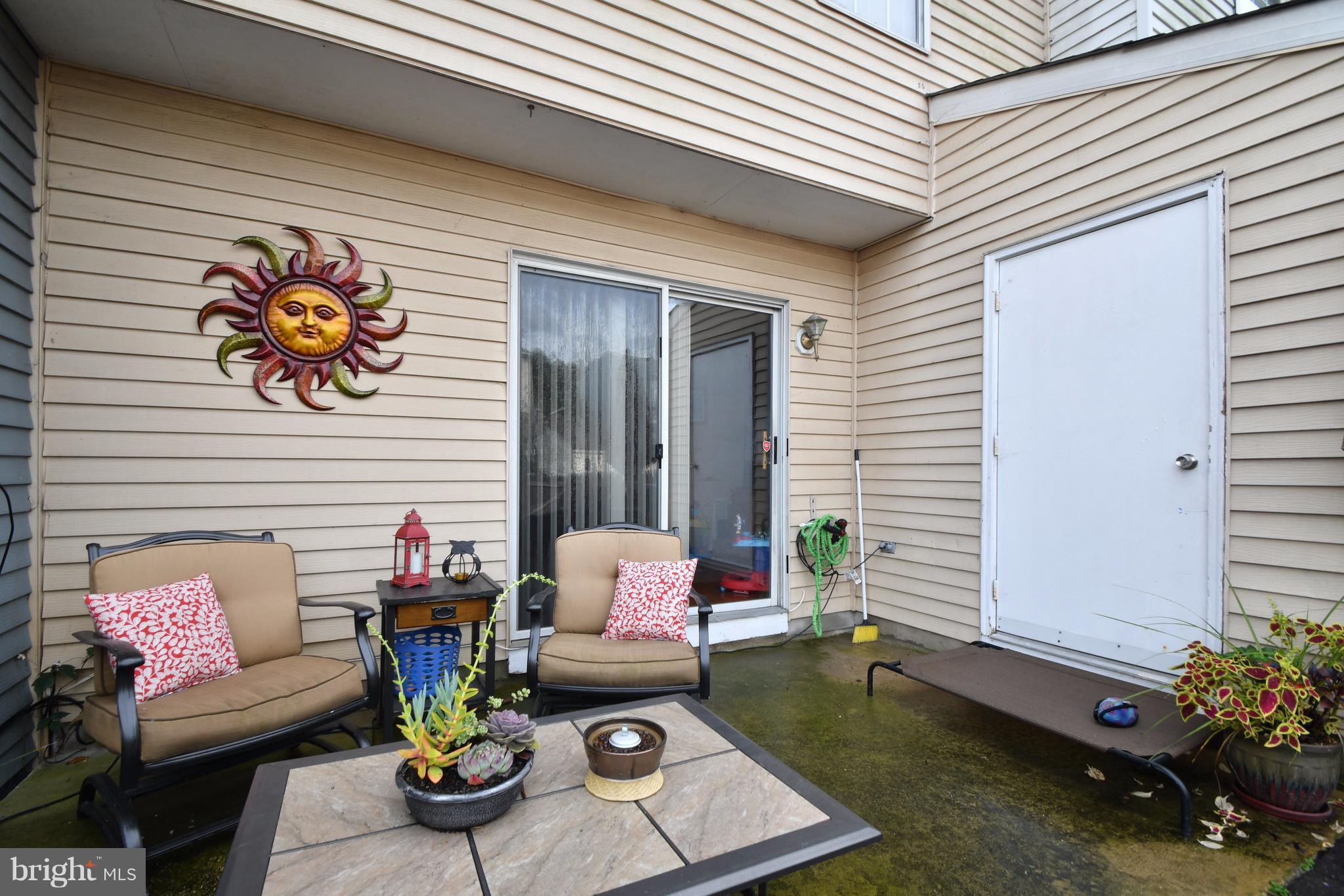 3924 Cutty Sark Road Baltimore, MD 21220 - Photo 26 of 30 a outdoor living space with furniture and a potted plant
