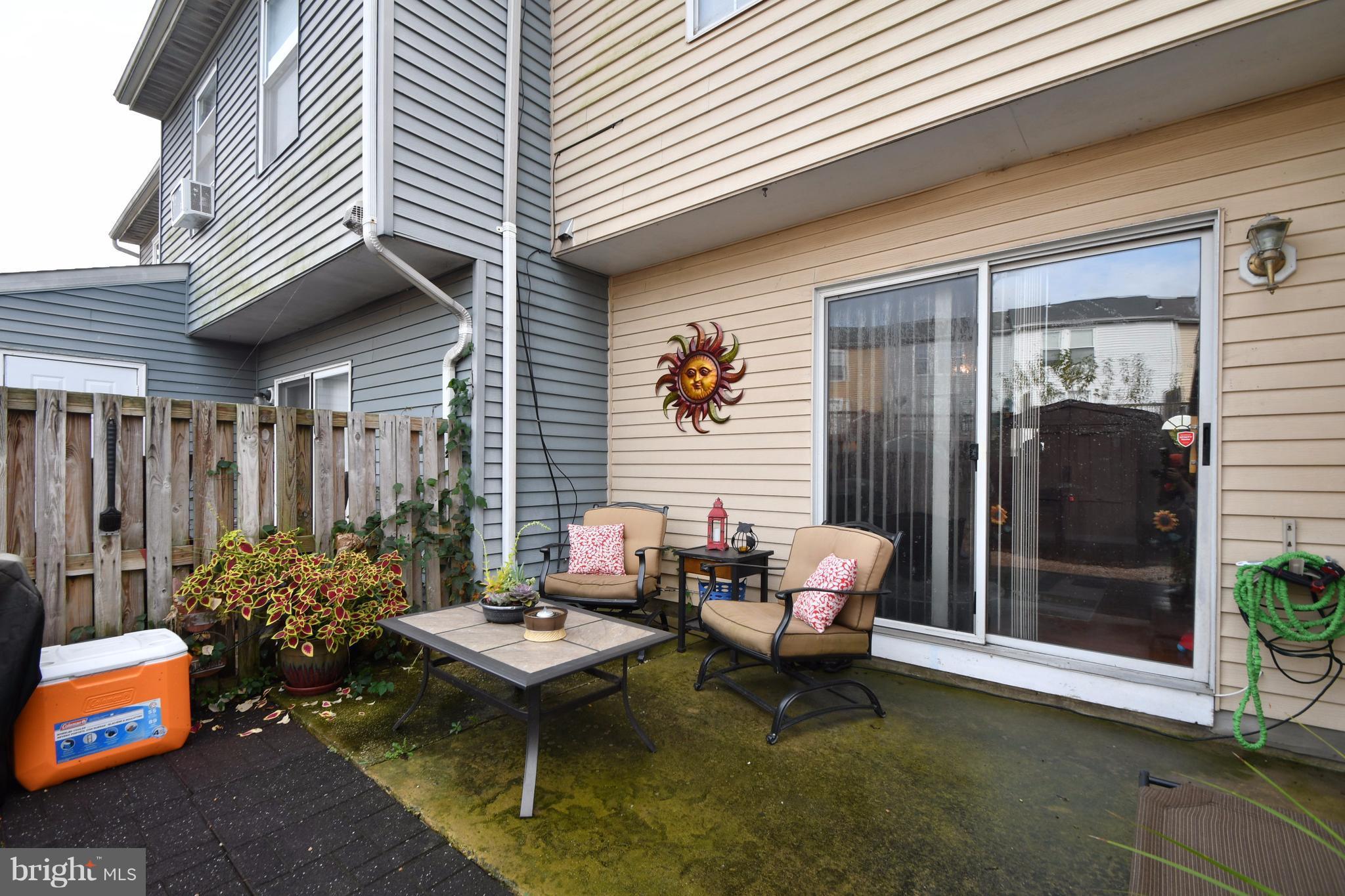 3924 Cutty Sark Road Baltimore, MD 21220 - Photo 27 of 30 a backyard of a house with outdoor seating