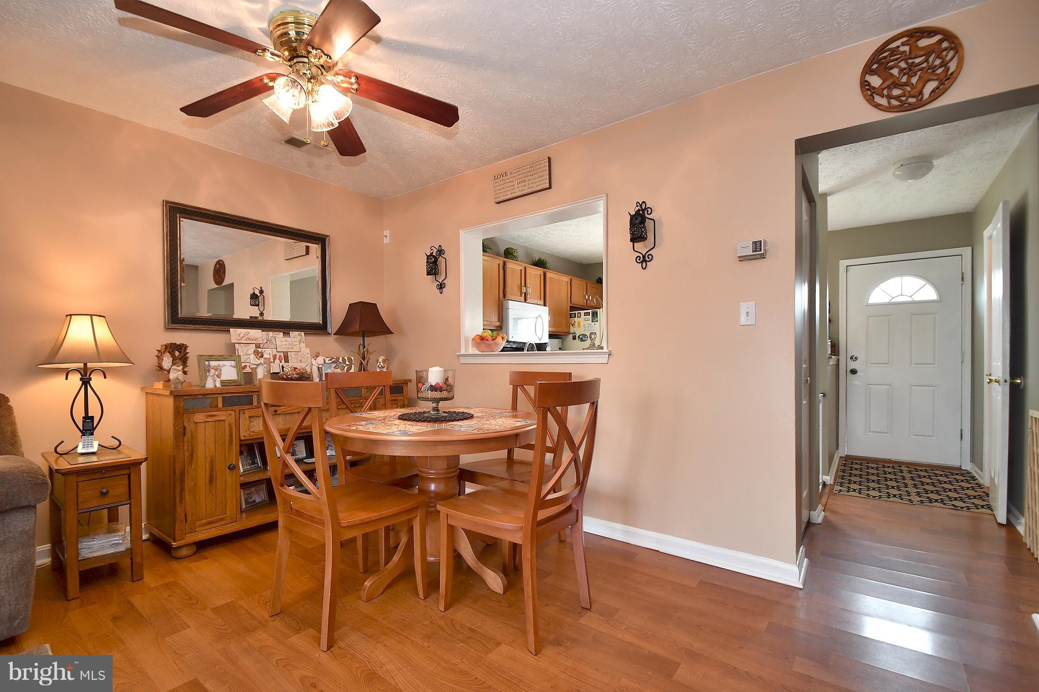 3924 Cutty Sark Road Baltimore, MD 21220 - Photo 7 of 30 a view of a dining room with furniture and wooden floor