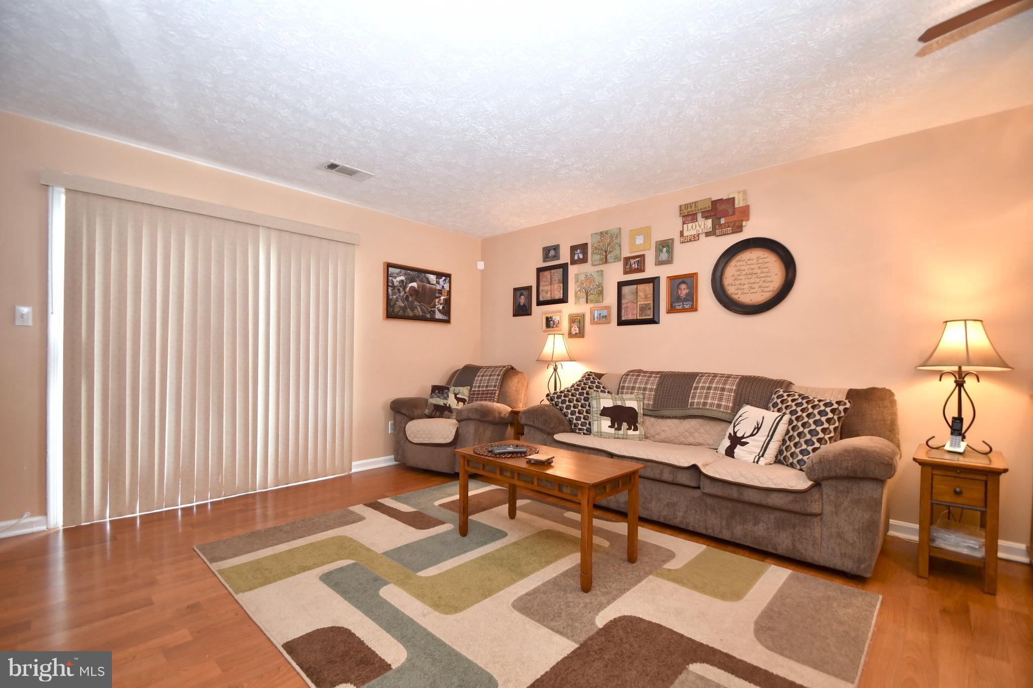 3924 Cutty Sark Road Baltimore, MD 21220 - Photo 8 of 30 a living room with furniture and wooden floor