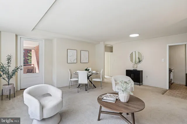 a dining room with furniture and window