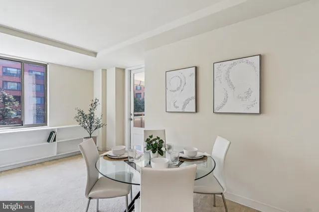 a living room with furniture and white walls
