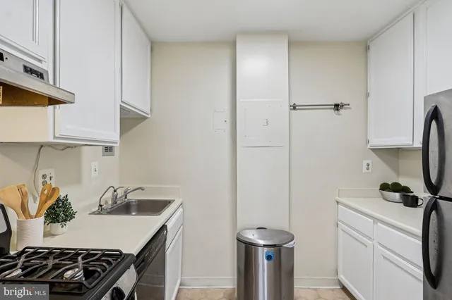 a white refrigerator freezer sitting inside of a kitchen