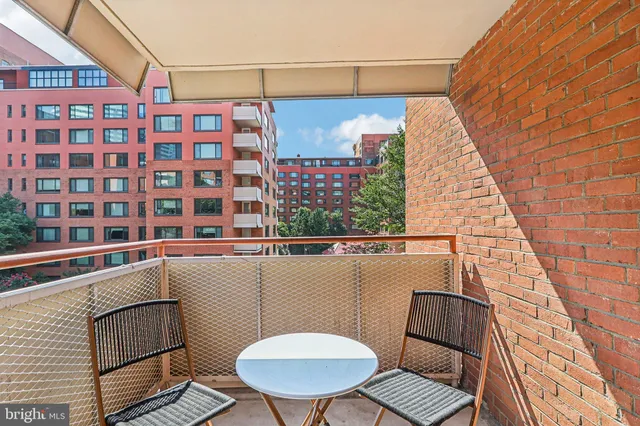 a backyard of a house with yard and outdoor seating