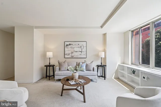 a living room with furniture and a table