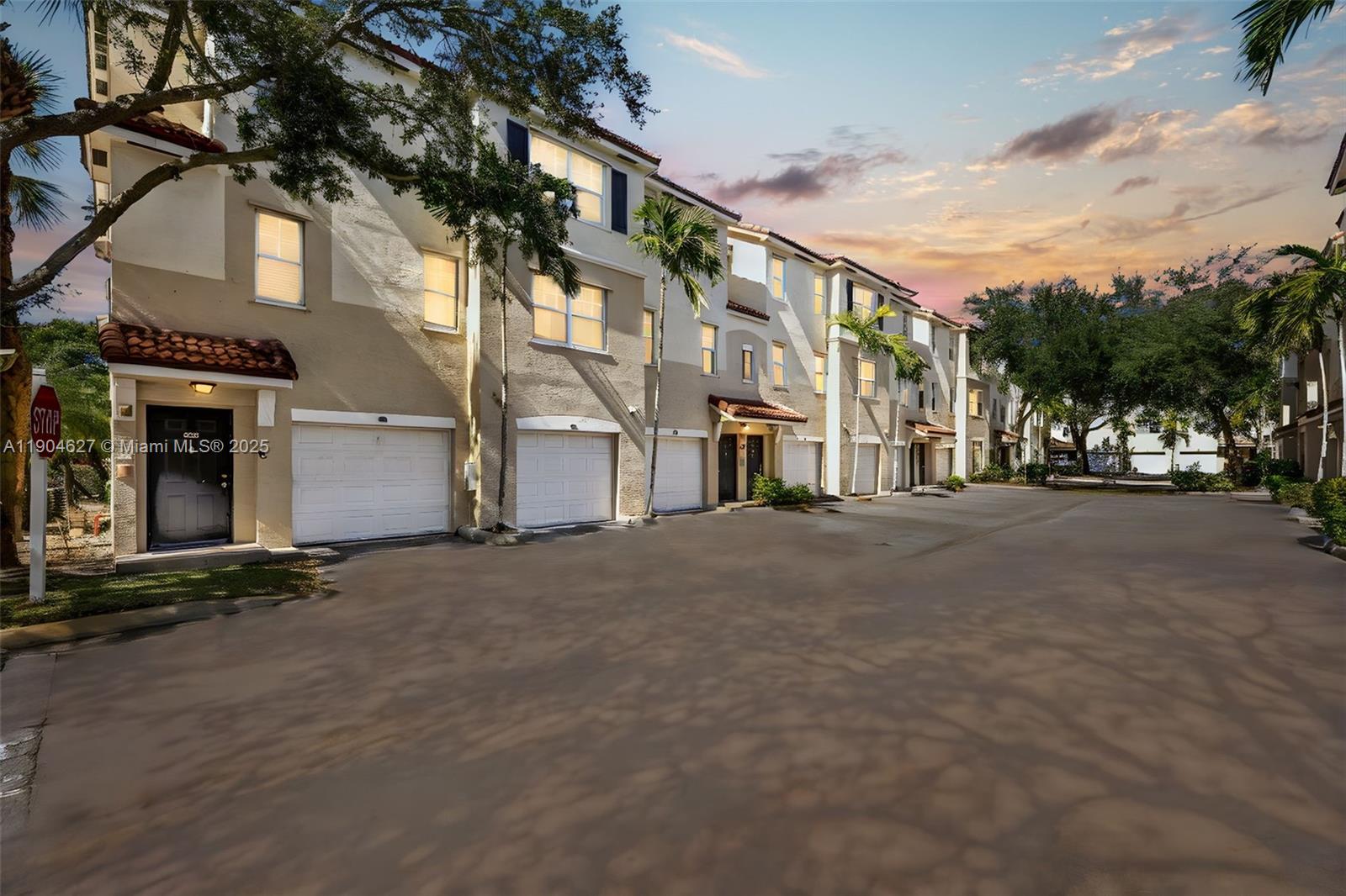 a view of a street with a building in the background
