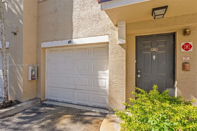 a front view of a house with a garage
