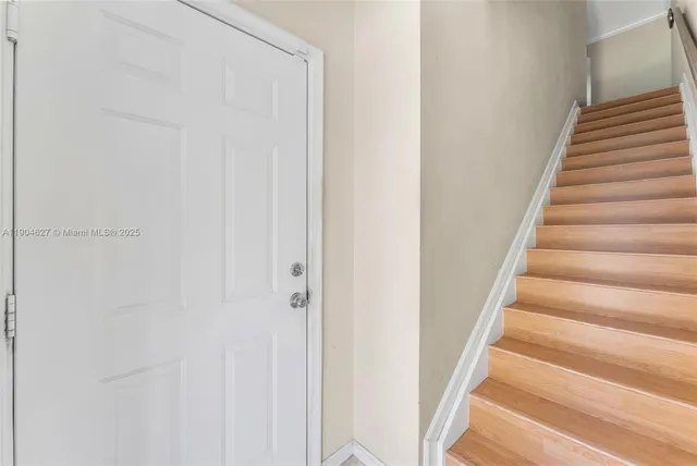a view of staircase with white walls