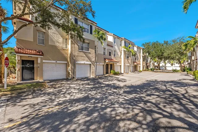 a view of a building with a snow on the road