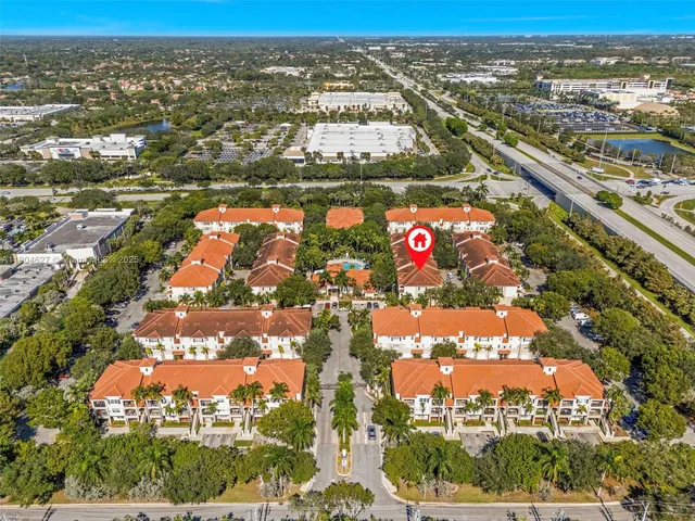 an aerial view of residential building and lake
