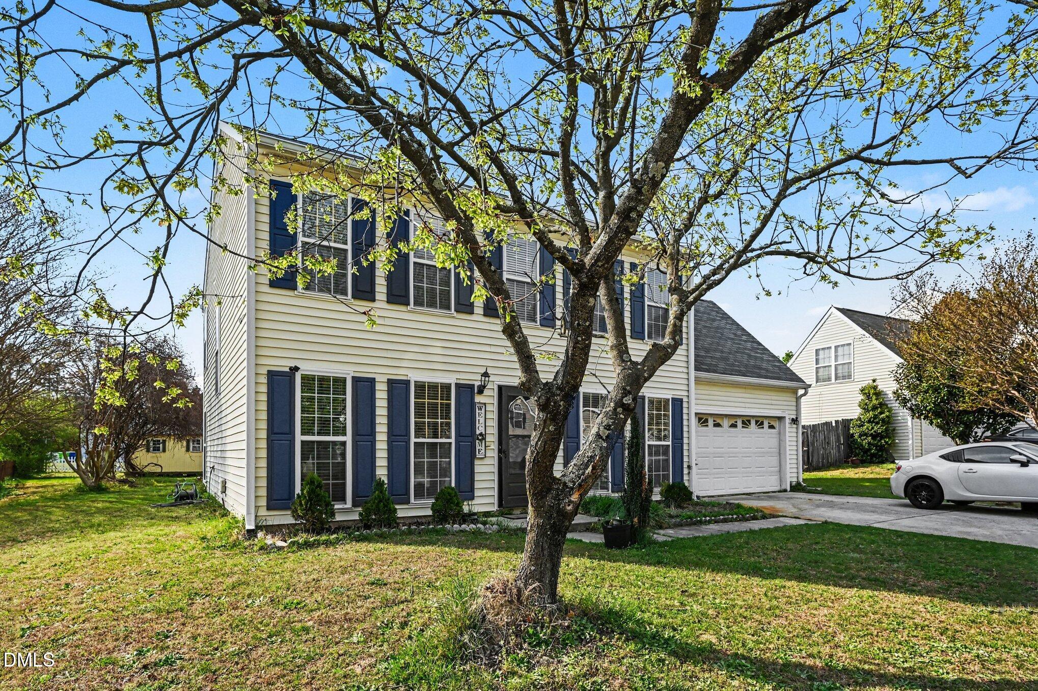 5115 Cardinal Grove Boulevard Raleigh, NC 27616 - Photo 23 of 36 a front view of a house with a yard