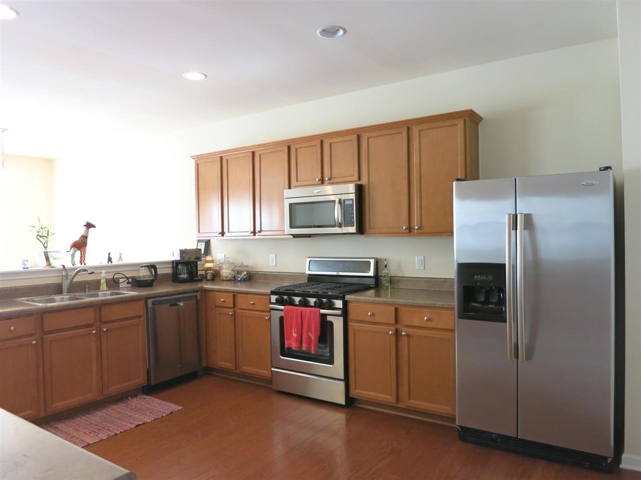 3808 Althorp Drive Raleigh, NC 27616 - Photo 7 of 25 The Kitchen features lots of maple cabinets & granite-look laminate ctrs, stainless steel appliances (including microwave, dishwasher & gas range), walk-in pantry & recessed lighting.
