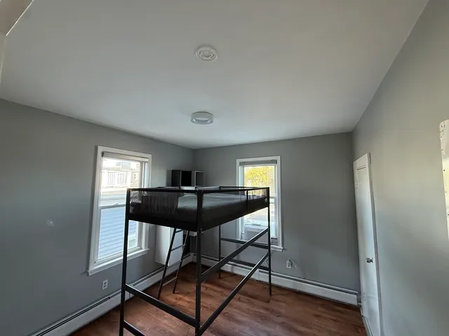 a living room with a table and a window