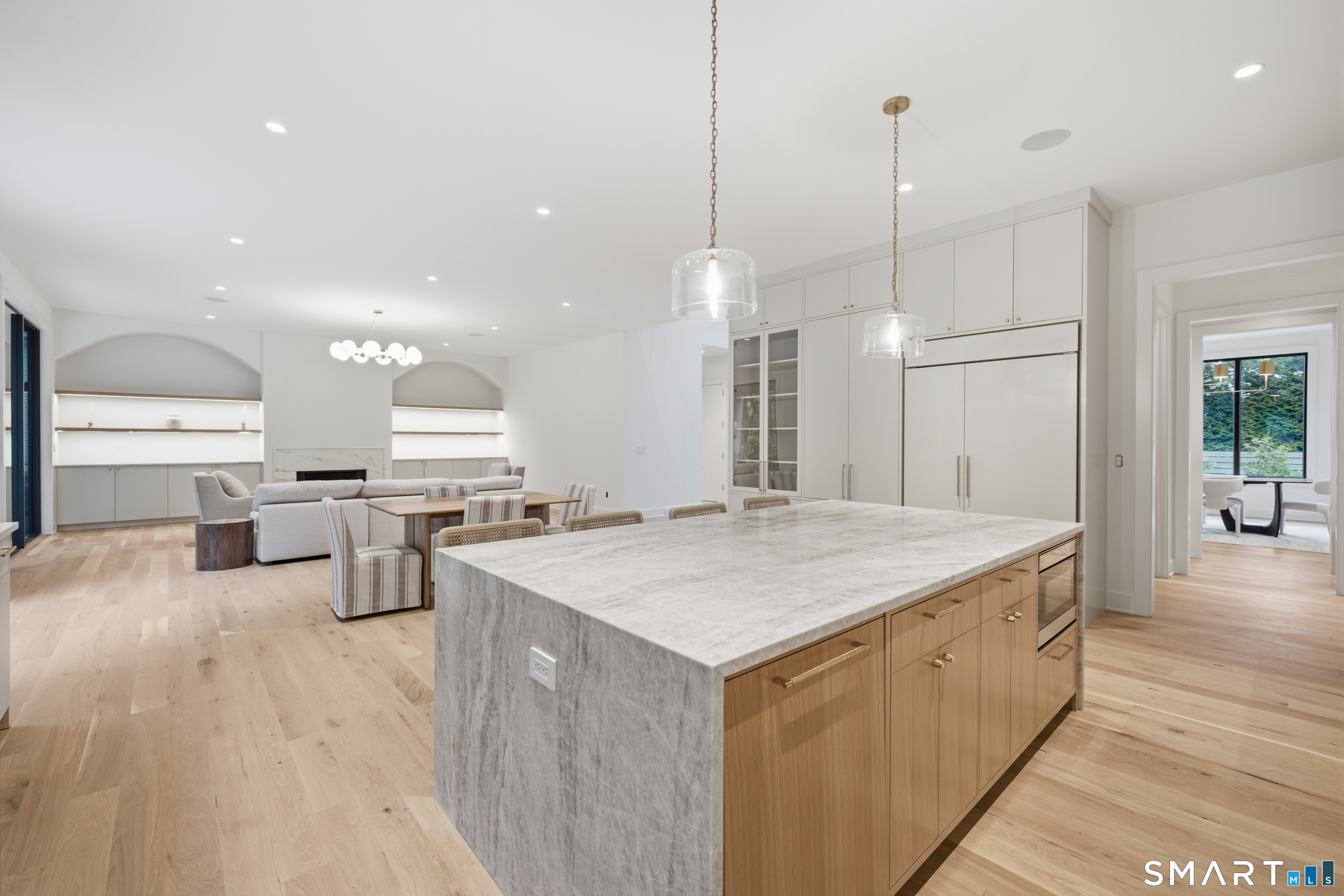 2 Windy Hill Road Westport, CT 06880 - Photo 12 of 40 a large kitchen with kitchen island a sink a stove a dining table and chairs