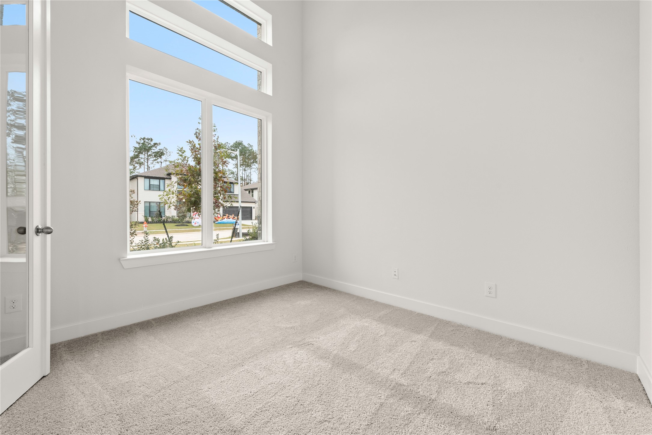 18917 Moonriver Street Conroe, TX 77302 - Photo 12 of 28 a view of an empty room with a window