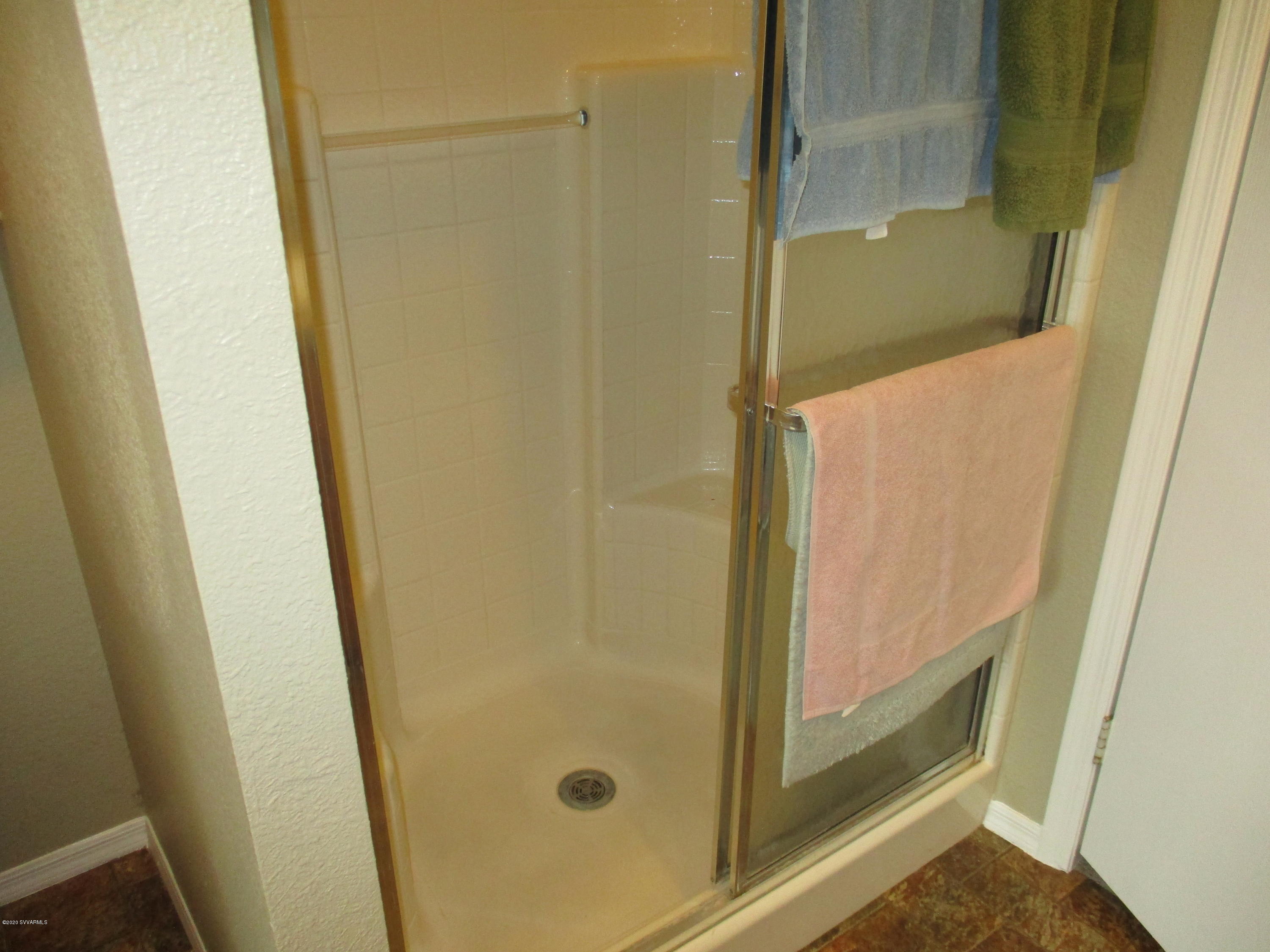 4190 East Aztec Road Rimrock, AZ 86335 - Photo 11 of 35 a bathroom with a glass door shower
