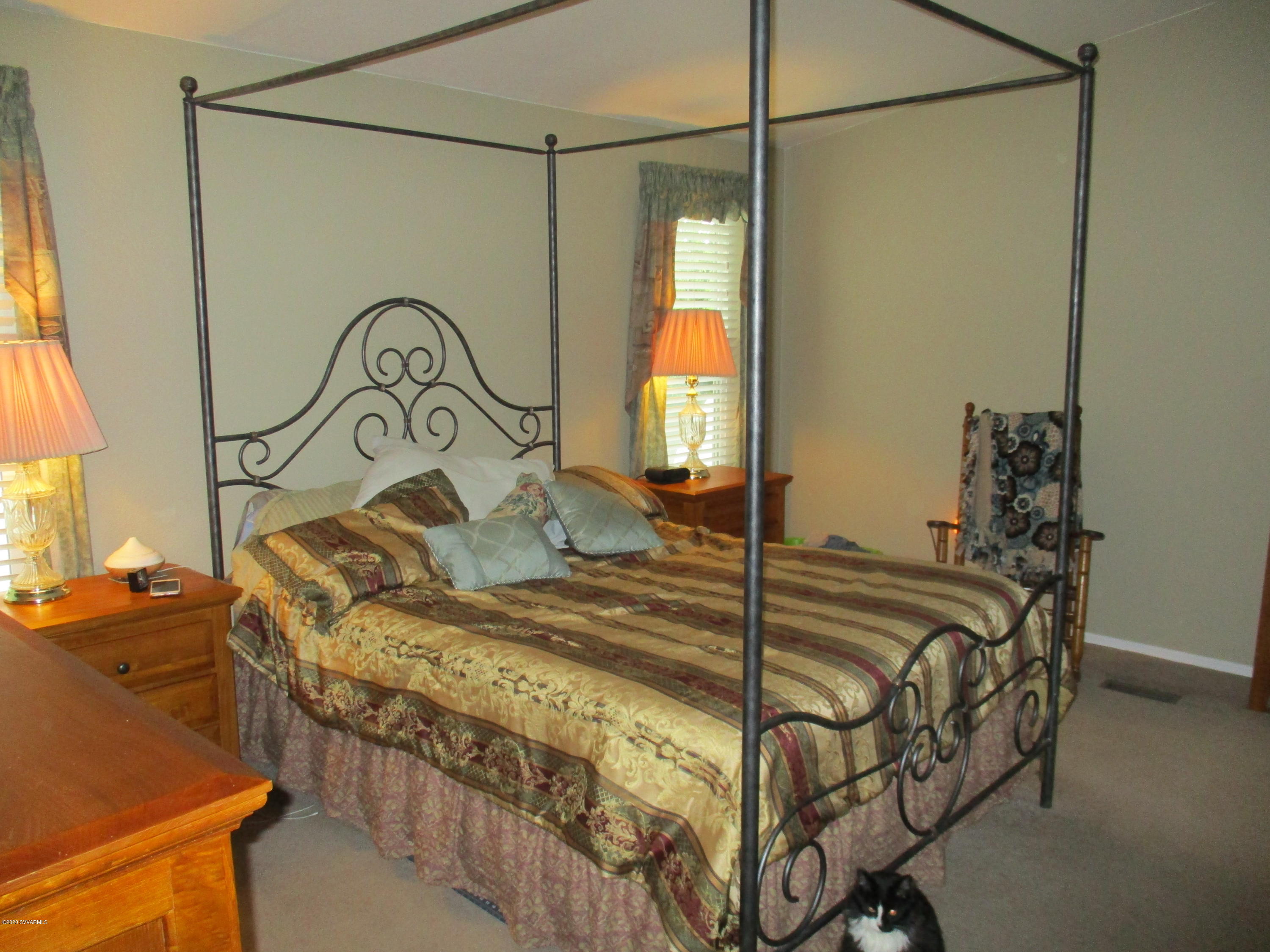 4190 East Aztec Road Rimrock, AZ 86335 - Photo 12 of 35 a bed sitting in a bedroom next to a window