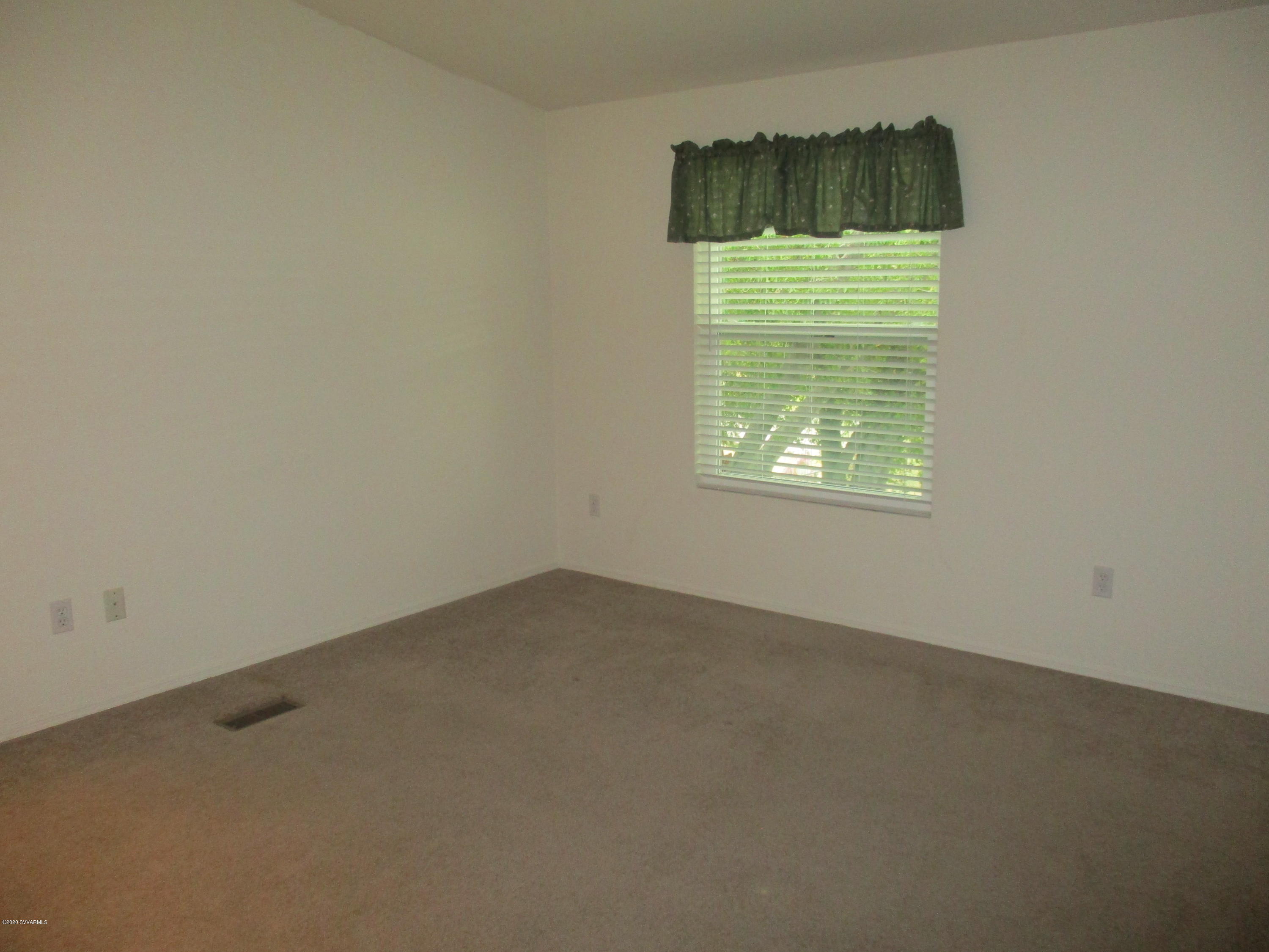 4190 East Aztec Road Rimrock, AZ 86335 - Photo 13 of 35 an empty room with a window