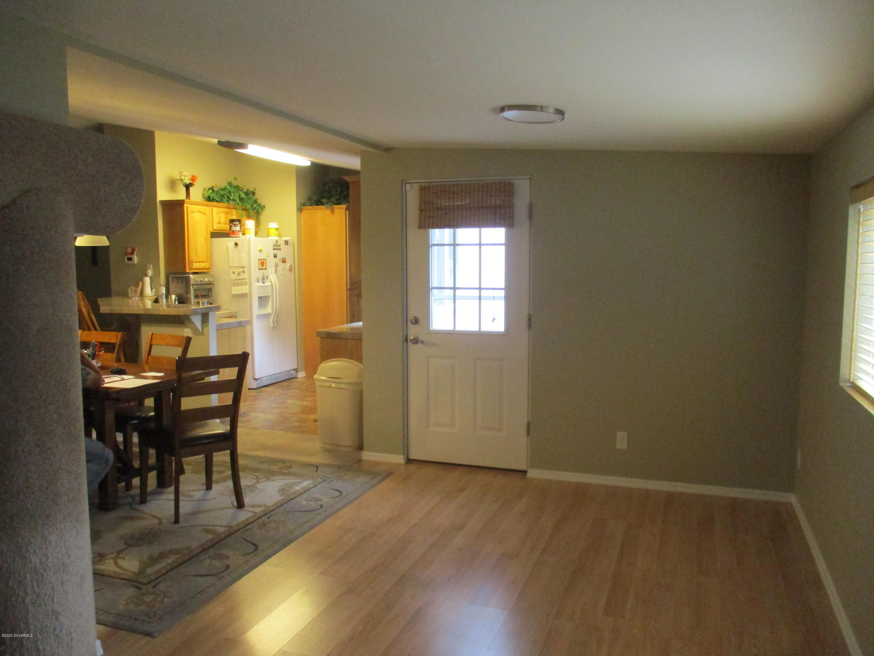 4190 East Aztec Road Rimrock, AZ 86335 - Photo 15 of 35 a view of a dining room with furniture and wooden floor