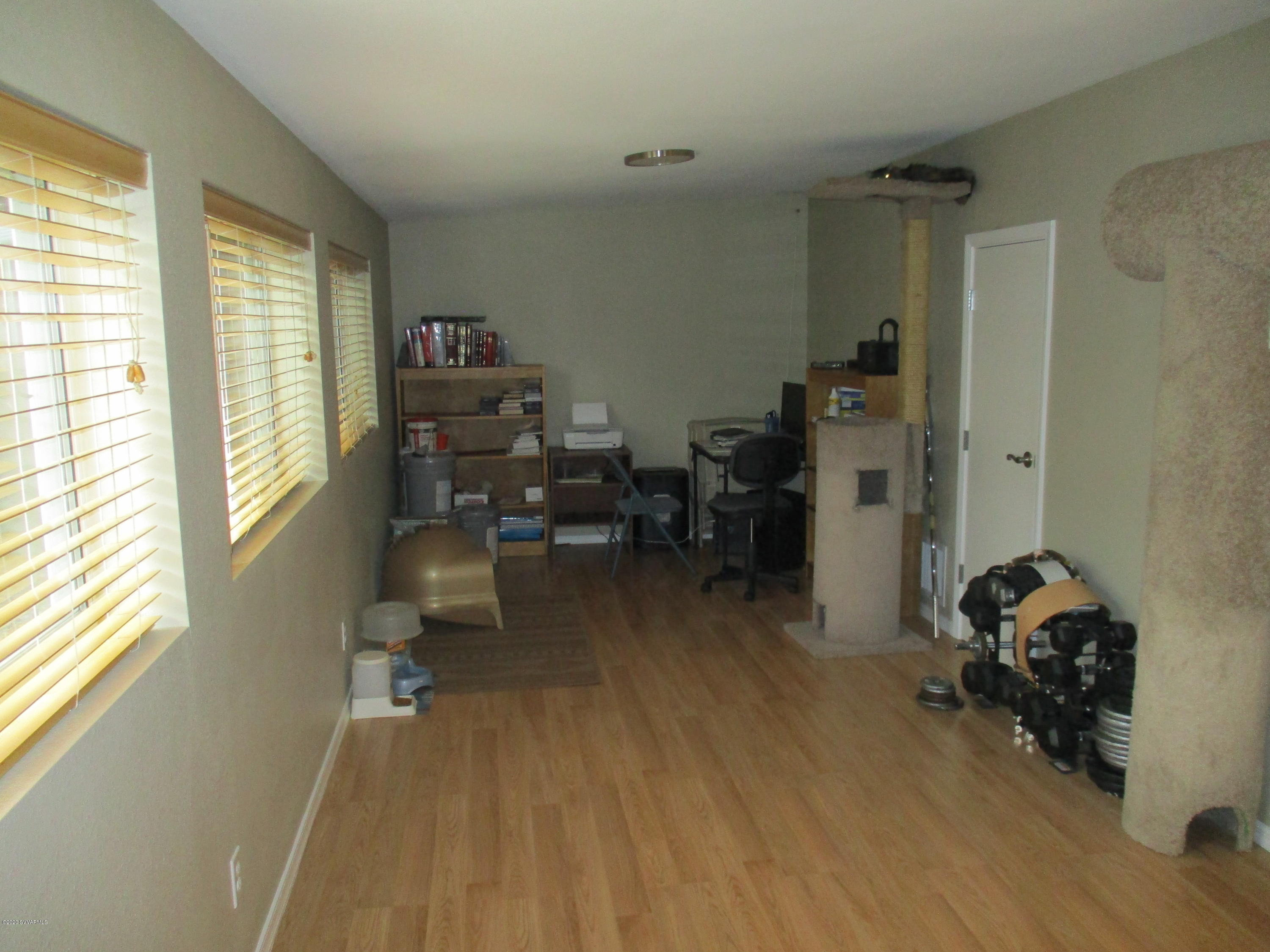 4190 East Aztec Road Rimrock, AZ 86335 - Photo 16 of 35 a view of a workspace with furniture and a window