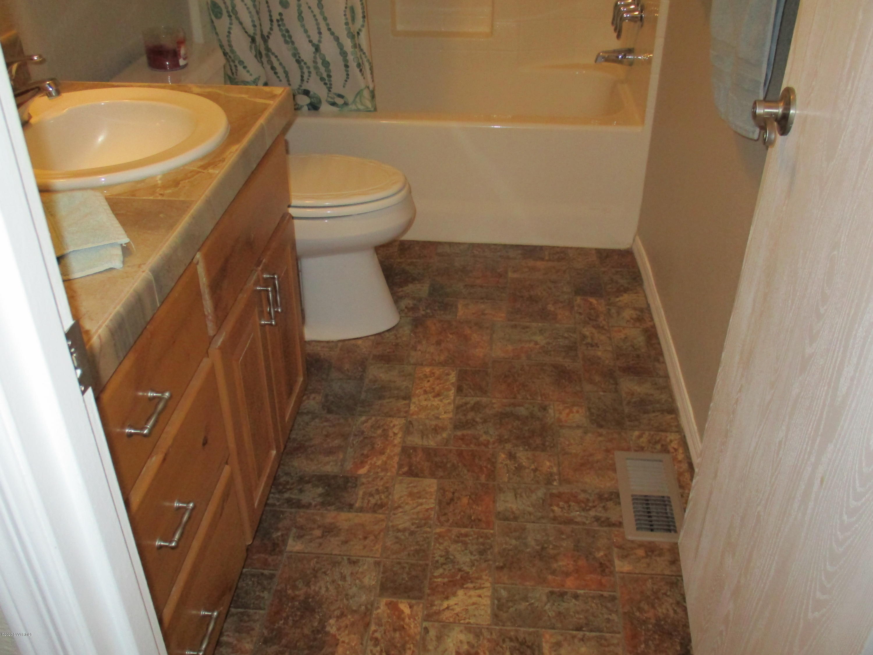 4190 East Aztec Road Rimrock, AZ 86335 - Photo 17 of 35 a bathroom with a sink and a toilet