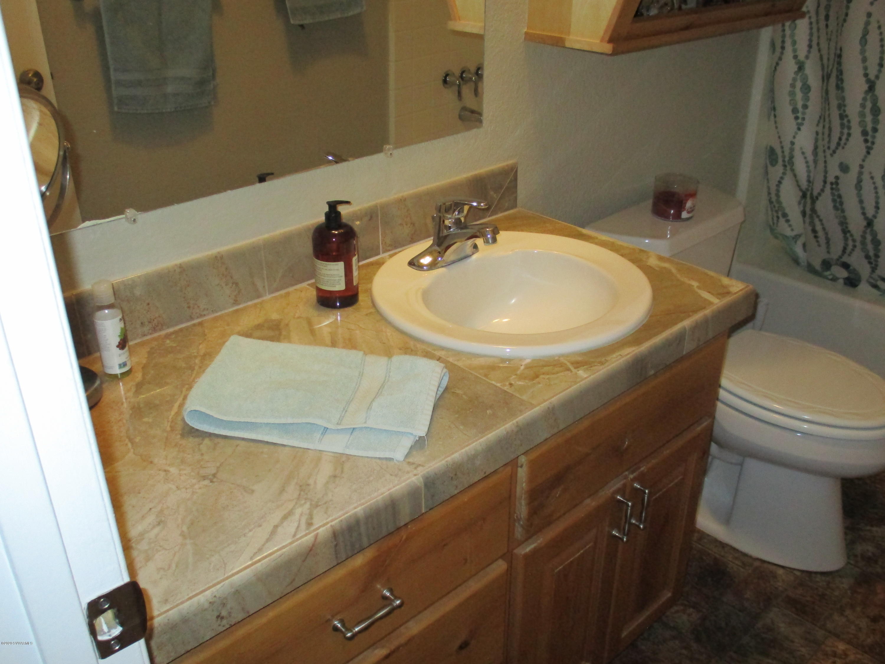 4190 East Aztec Road Rimrock, AZ 86335 - Photo 18 of 35 a bathroom with a sink and toilet