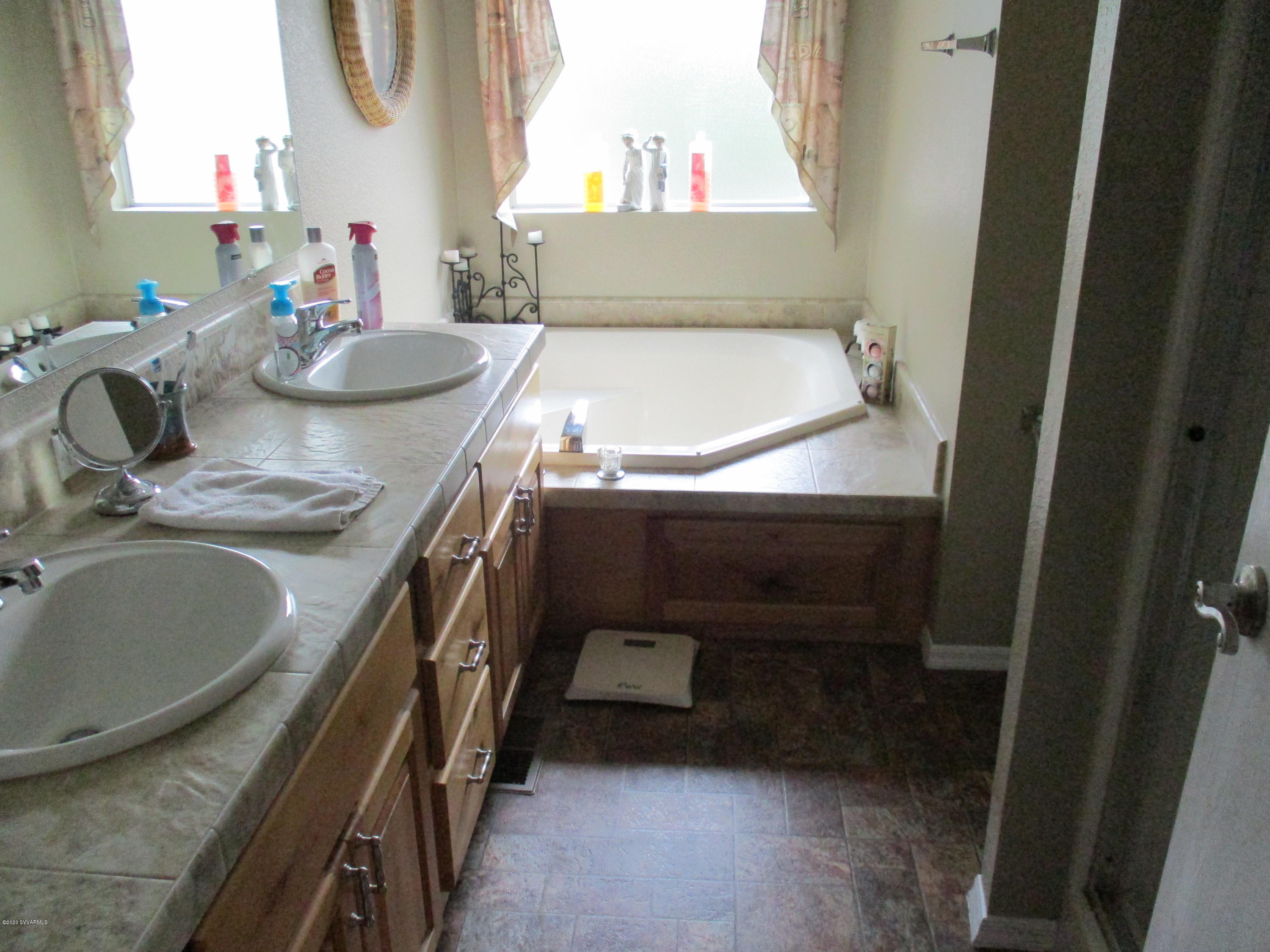 4190 East Aztec Road Rimrock, AZ 86335 - Photo 10 of 35 a bathroom with a sink and a bathtub