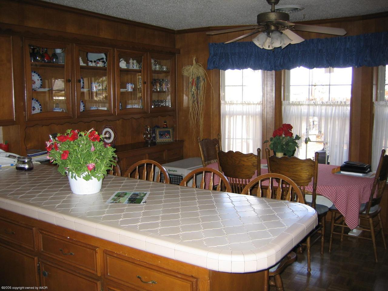 7212 Calumet Road Amarillo, TX 79106 - Photo 3 of 8 a view of a dining room with furniture window and outside view