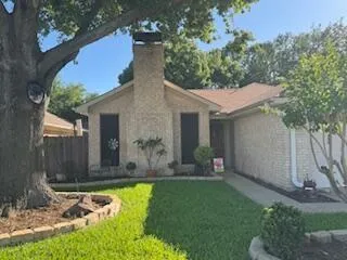 a view of a house with pool and garden
