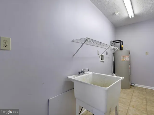 a bathroom with a tub and sink