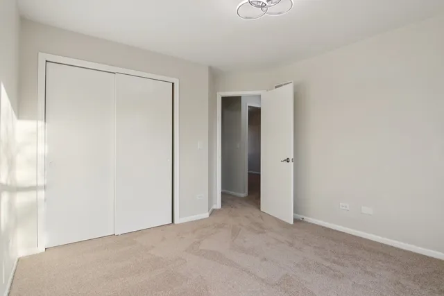 a view of a yard with wooden fence and trees