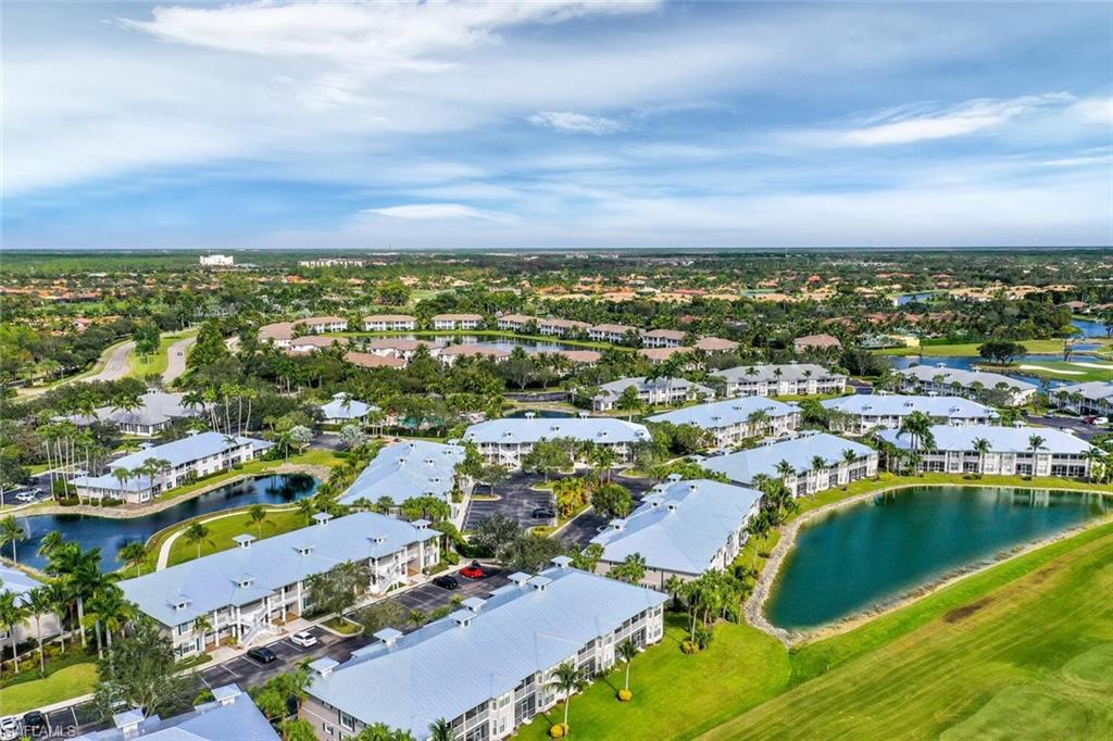 7955 Mahogany Run Lane, Unit 515 Naples, FL 34113 - Photo 10 of 20 an aerial view of residential building and lake